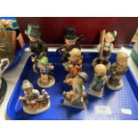 A tray of nine Goebel figures of girls and boys.