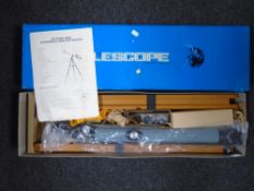 An astronomical refractor telescope (boxed).