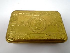 A reproduction 1914 brass Christmas tin.