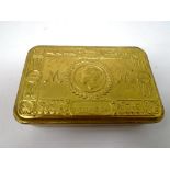 A reproduction 1914 brass Christmas tin.