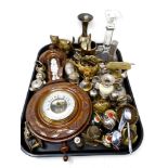 A tray containing a barometer, assorted brass ware, bells, glass candlestick, ornaments etc.