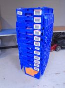 A collection of 12 plastic storage crates with lids.