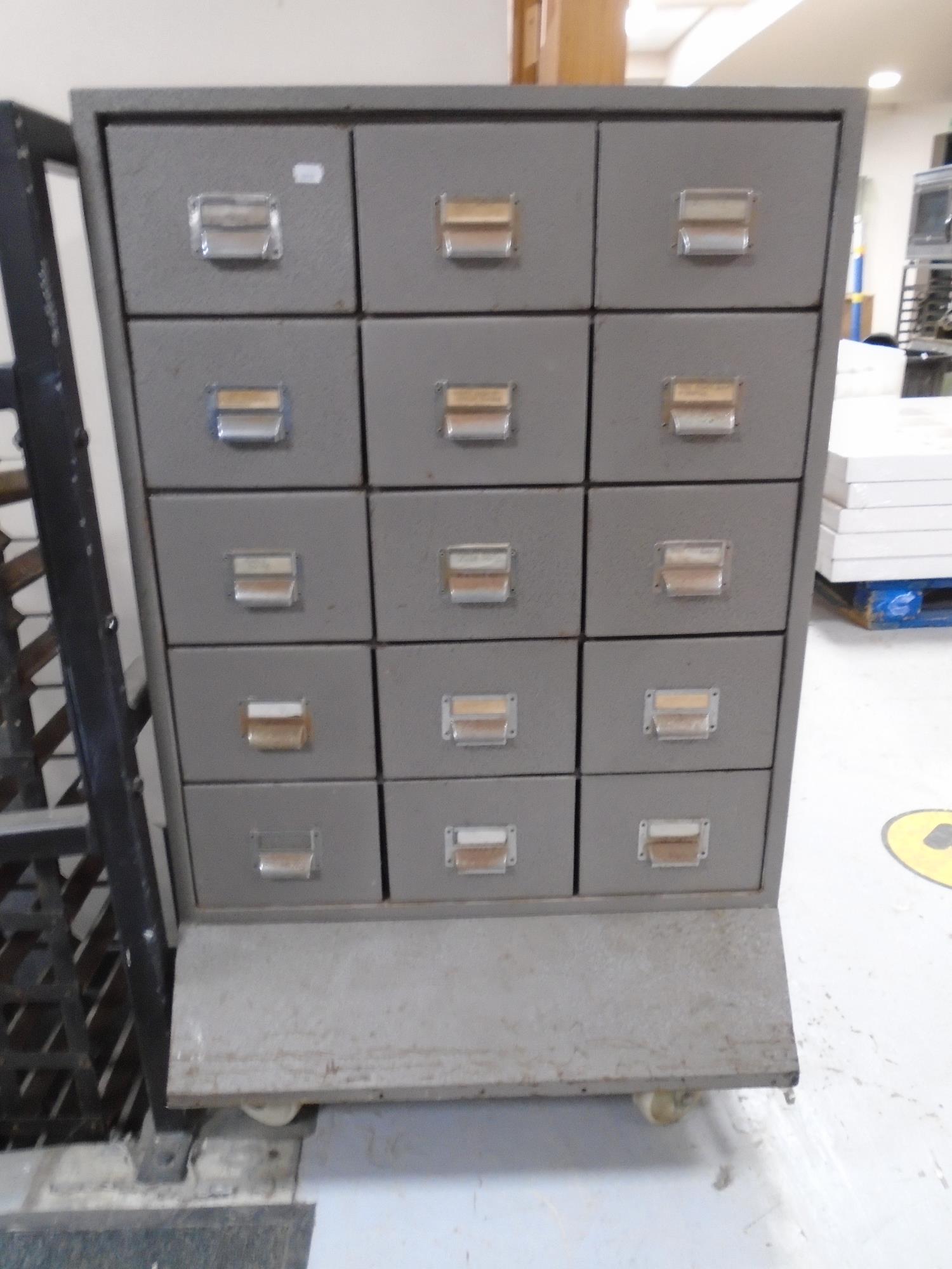 A 20th century fifteen drawer metal industrial style filing chest on castors.