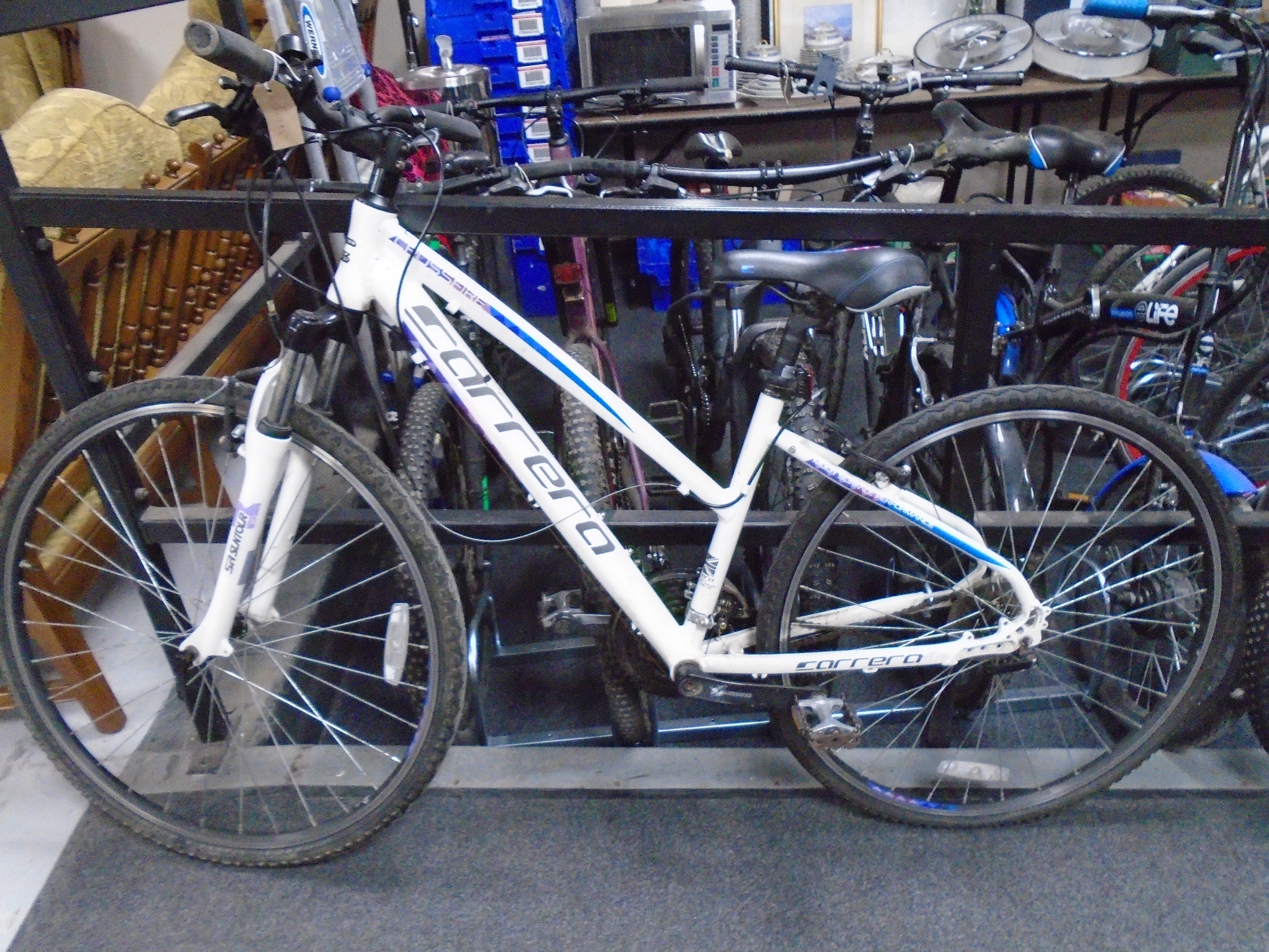 A lady's Carrera Crossfire front suspension mountain bike.