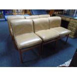 A set of six mid-20th century Scandinavian teak dining chairs upholstered in tan vinyl.