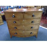A Victorian mahogany two-over-three bow fronted five drawer chest.
