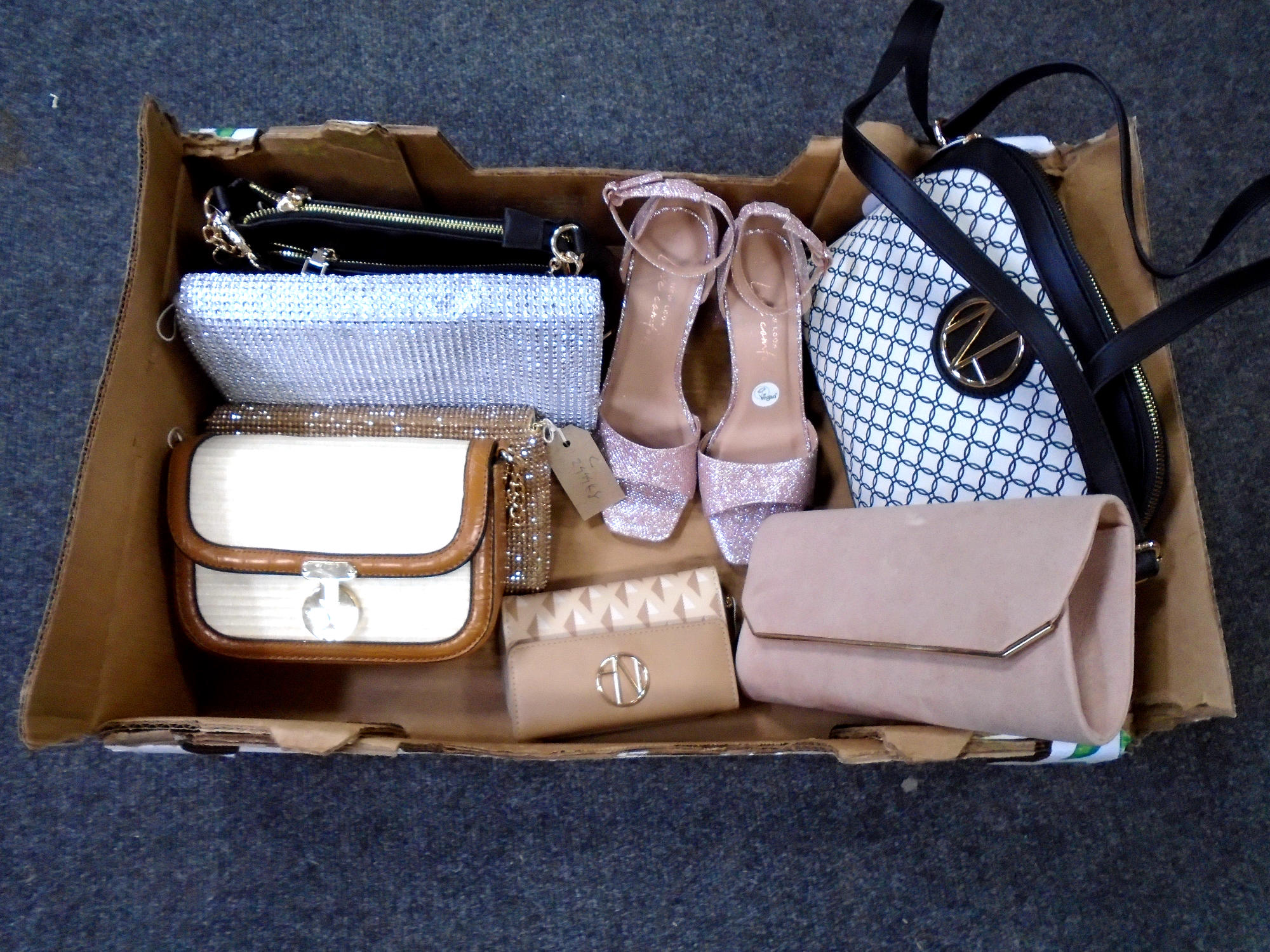 A box containing assorted lady's hand and clutch bags, New Look shoes (new with tags).