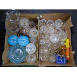 Two boxes containing 20th century clear and coloured glassware, petrol glass bowls, flower vase,