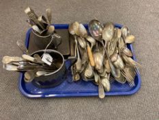 A quantity of antique and later cutlery, silver plated jug and sugar basin, cased spoons etc.