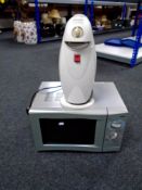 A Sanyo microwave together with a Delonghi electric heater,