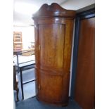 A 19th century continental birch double corner cabinet.