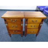 A pair of Empire style three drawer bedside chests with drop handles.