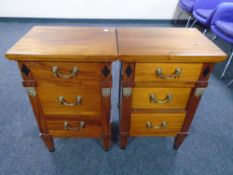 A pair of Empire style three drawer bedside chests with drop handles.