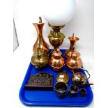 A tray containing assorted metalware including a brass oil lamp with chimney and opaque shade,