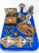 A tray containing plated candlestick, similar dwarf candlestick, sifter,