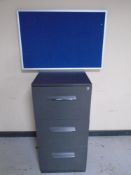 A three drawer filing chest together with three wall mounted notice boards.