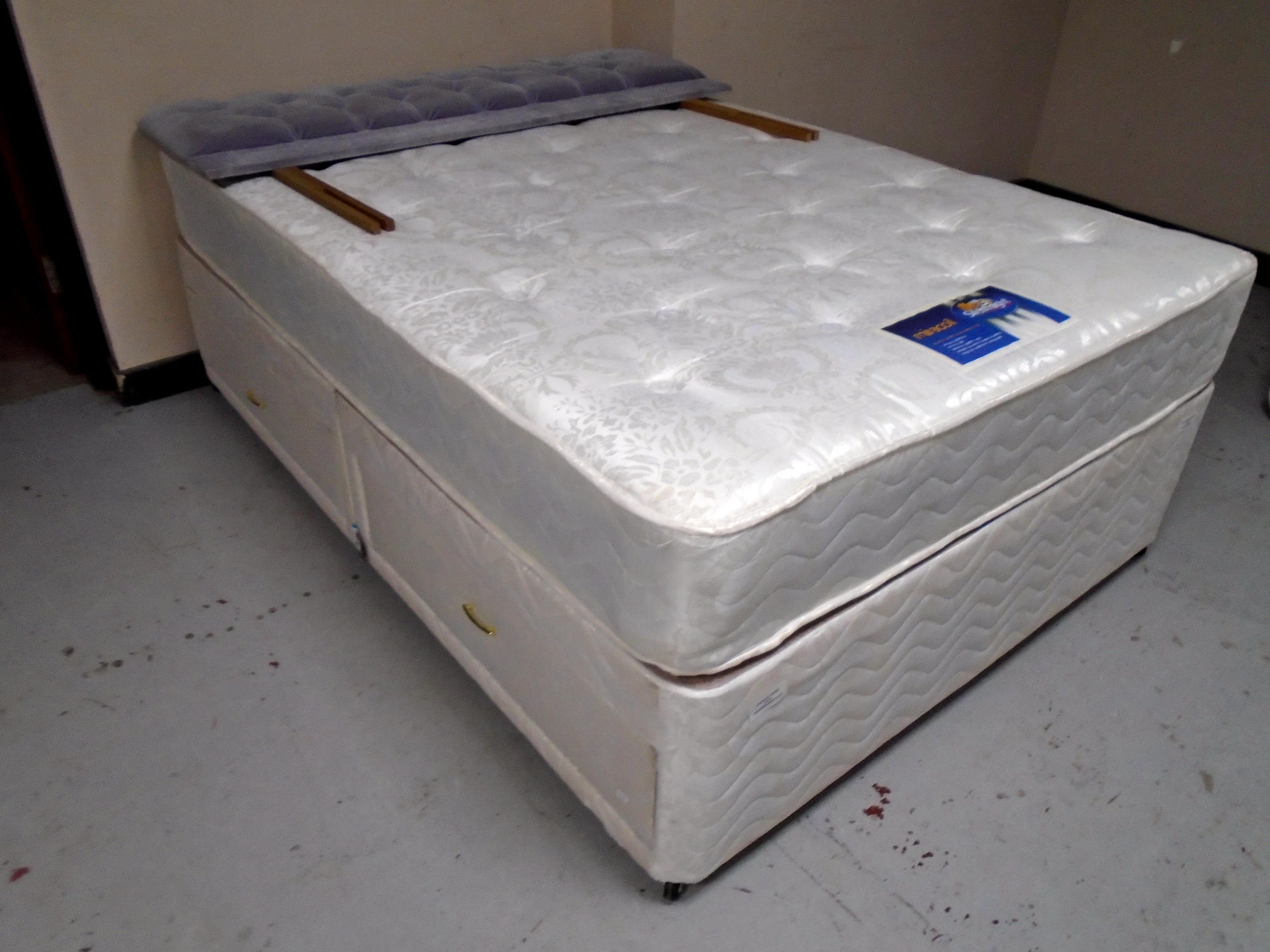 A 4'6" divan set with Silent Night Miracoil mattress.