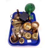 A tray containing metalware including a brass wall bracket, candlestick, napkin rings,