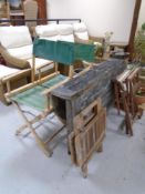 A teak folding garden table together with a teak folding occasional table and three folding