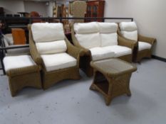 A five piece wicker conservatory suite comprising of a two seater settee, two armchairs,