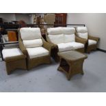 A five piece wicker conservatory suite comprising of a two seater settee, two armchairs,