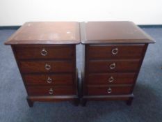 A pair of Stag Minstrel four drawer chests.