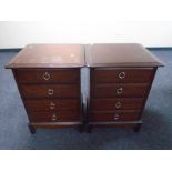 A pair of Stag Minstrel four drawer chests.
