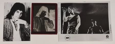 A Freddie Mercury negative of him in 1975 along with a photo of the band 'U2'.