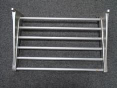 A stainless steel wall shelf.