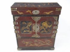 An antique Japanese lacquered wooden jewellery casket fitted with a drawer.