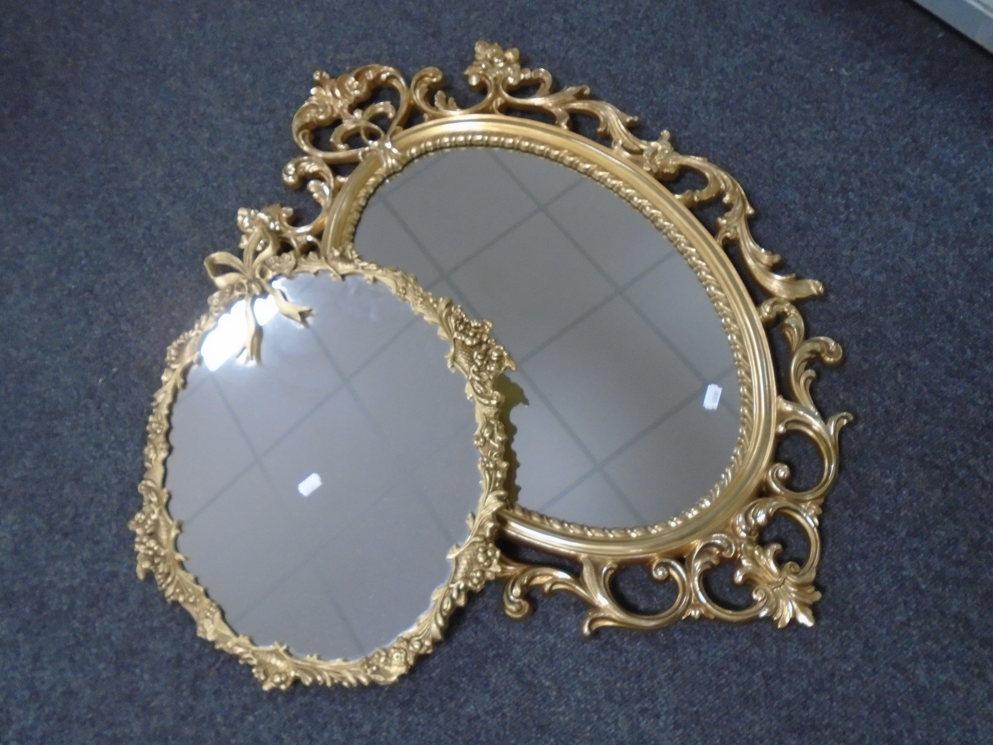 Two decorative gilt framed mirrors. CONDITION REPORT: 20th century metal and resin.