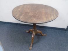 A mahogany circular tripod occasional table