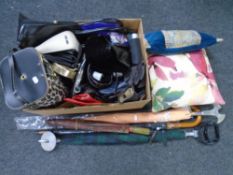 A box of bags, shooting stick, umbrella,