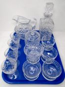 A tray of crystal, sundae dishes, wine glasses,