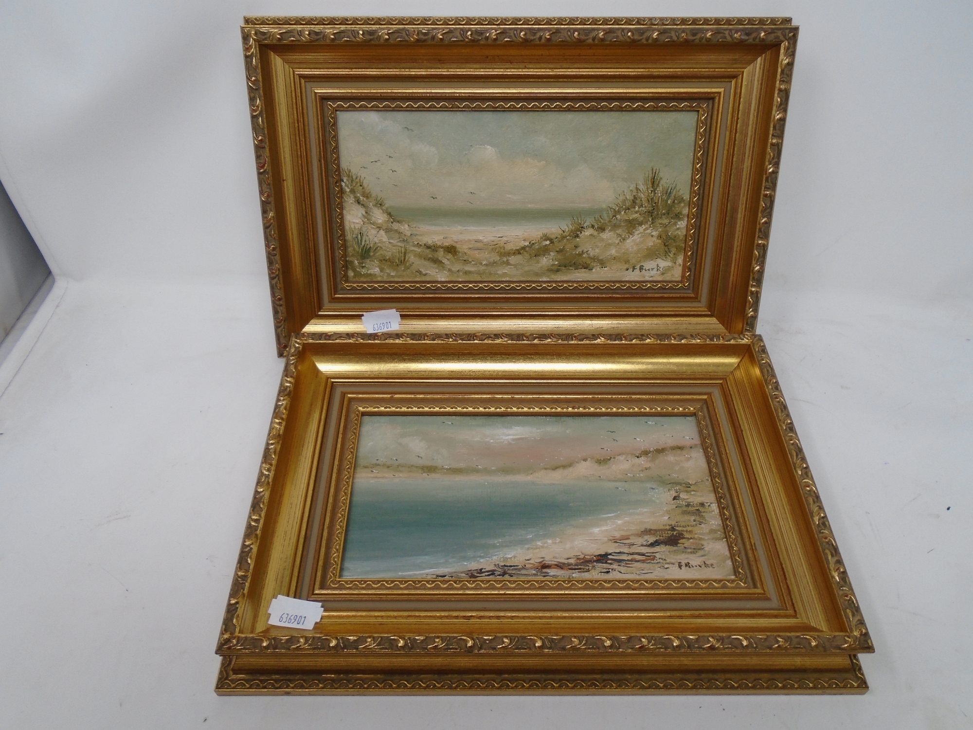 Frank Burke : A view across a beach, oil-on-board, 20cm by 11cm, together with a companion piece,