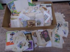 A box containing antique and later greetings cards.