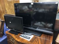 A Toshiba 32" LCD TV together with a Sharp 19" LCD TV, both with leads and remote.