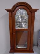 A Tempus Fugit Acctim Westminster chime wall clock.