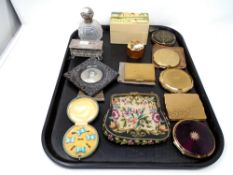 A tray containing a lady's compacts, card box, silver-topped cut-glass perfume bottle,
