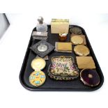 A tray containing a lady's compacts, card box, silver-topped cut-glass perfume bottle,