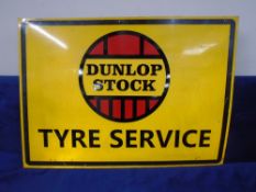 A garage sign on tin - Dunlop Stock Tyre Service.