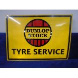 A garage sign on tin - Dunlop Stock Tyre Service.