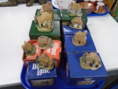 A tray of Lilliput lane cottages and houses.