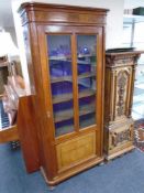 A 19th century mahogany glazed door bookcase on bun feet 189 cm x 78 cm x 33 cm