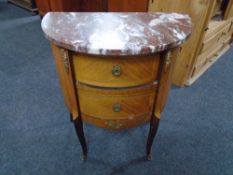A French Kingwood demi-lune two-tier marble-topped chest on raised legs