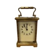 A brass cased French carriage clock, height 15cm including handle.