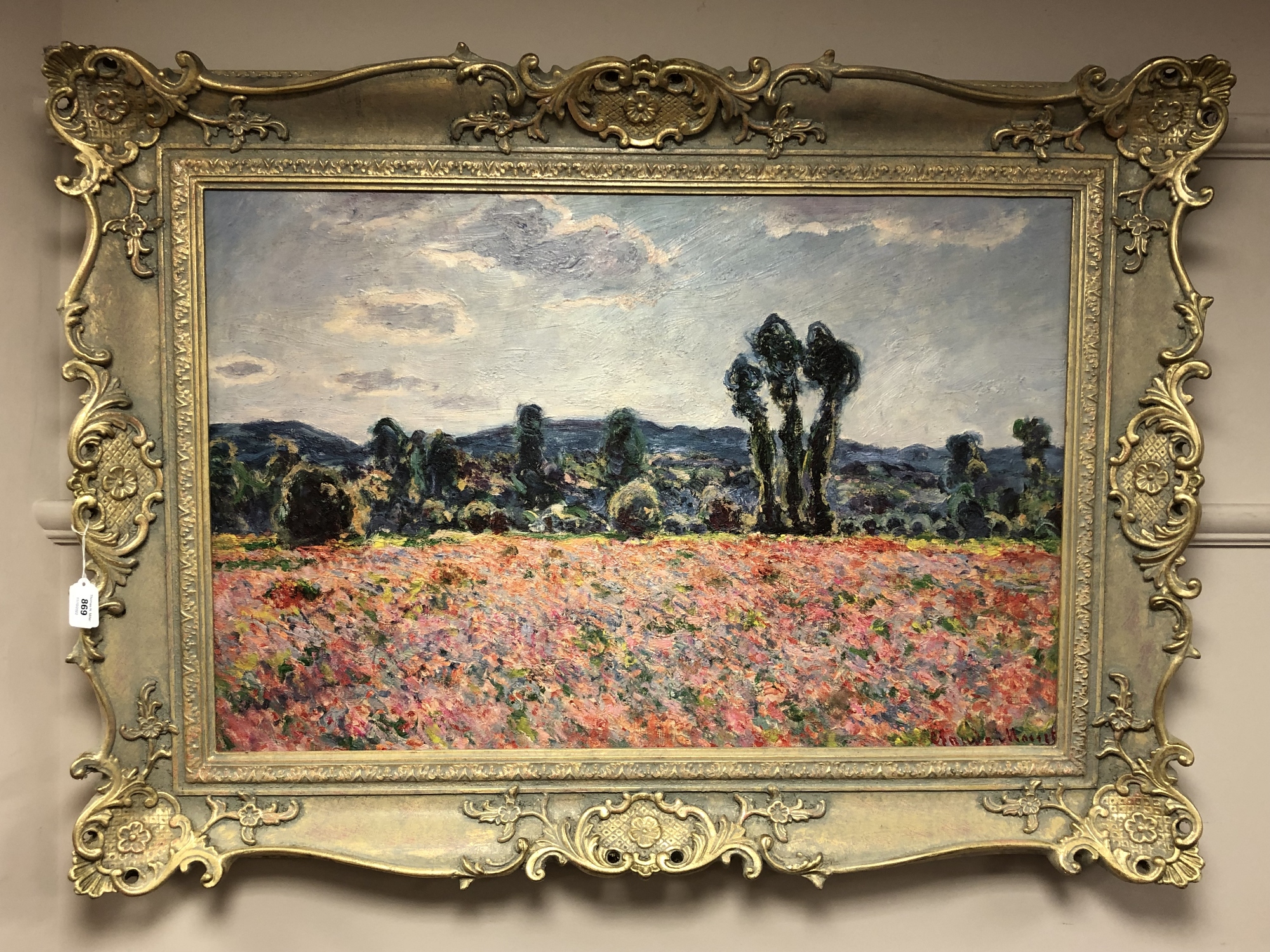 An Artagraph edition on canvas depicting a field of flowers with trees beyond, 88cm by 57cm.