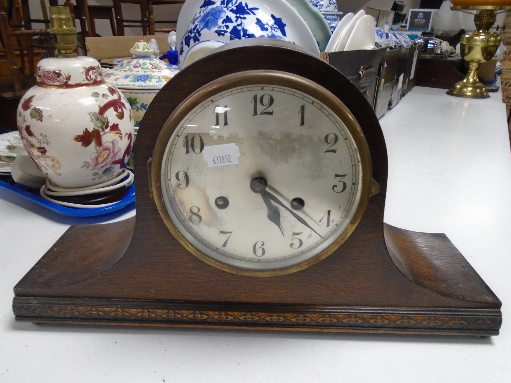 An Edwardian oak mantel clock.