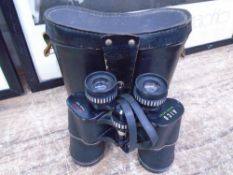 A set of cased Alco 10x50 field glasses.