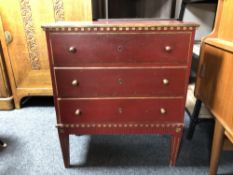 A painted pine three drawer chest